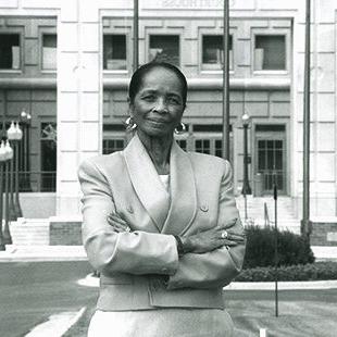 Edna Mosley in front of government building