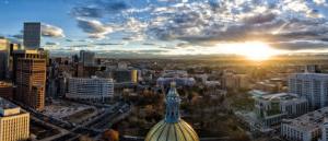 View of Denver from above at sunset with capitol building in foreground