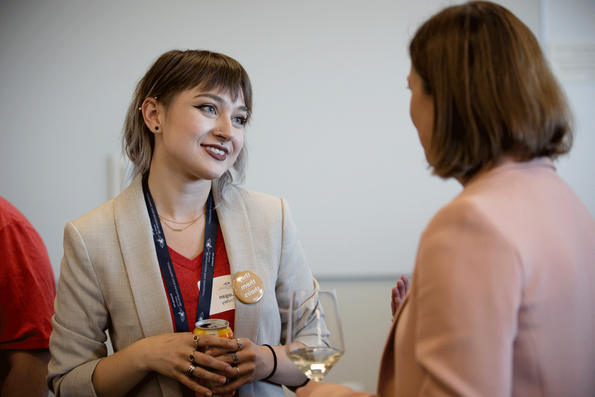 A female student talks with a female businesswoman