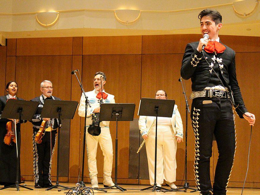 mariachi group performing on a stage